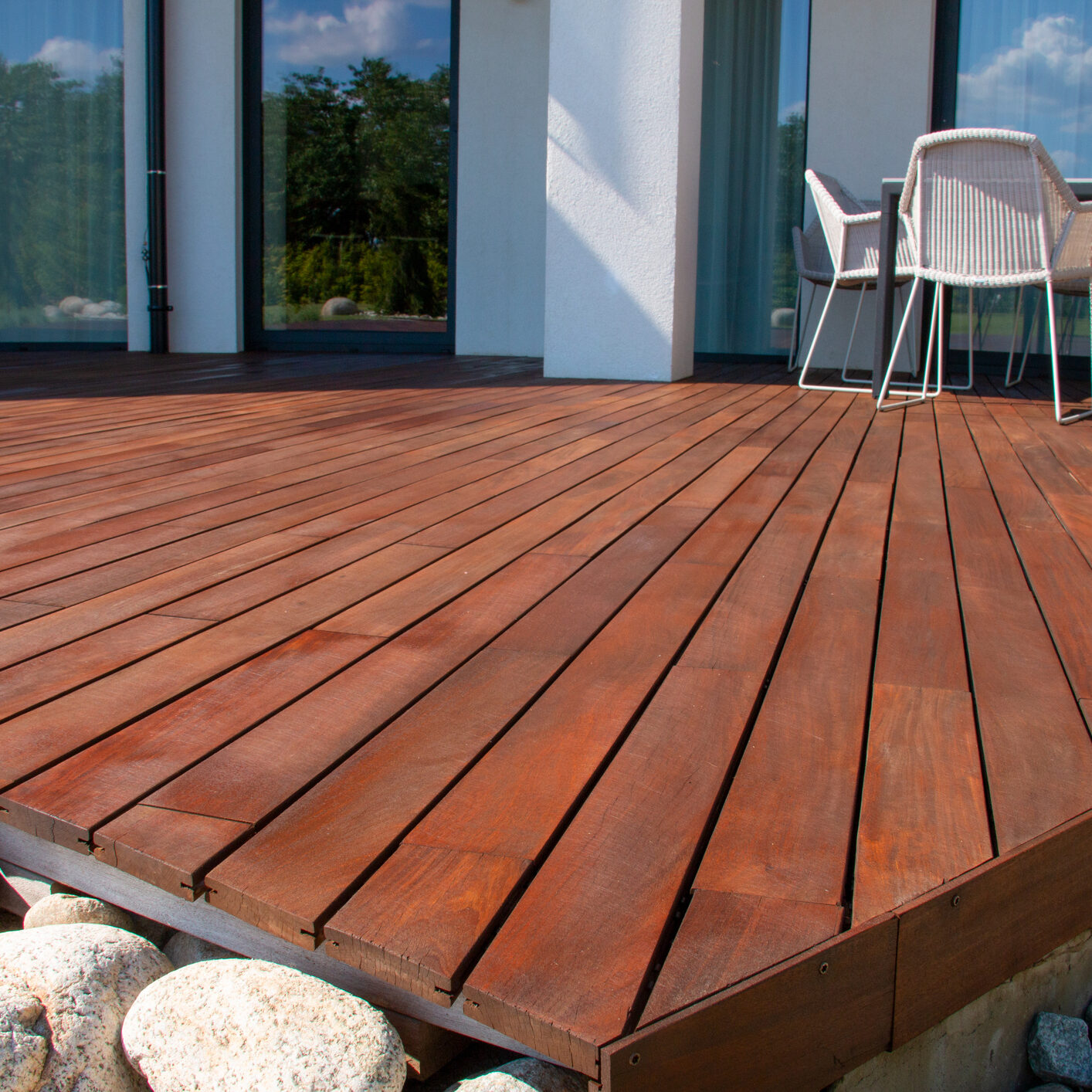 Wood deck, modern house design with wooden patio, low angle view of tropical hardwood decking